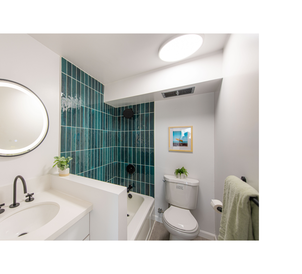 Fresh & Bold: White Paint, Emerald Green Shower Tiles & Chic Black Hardware