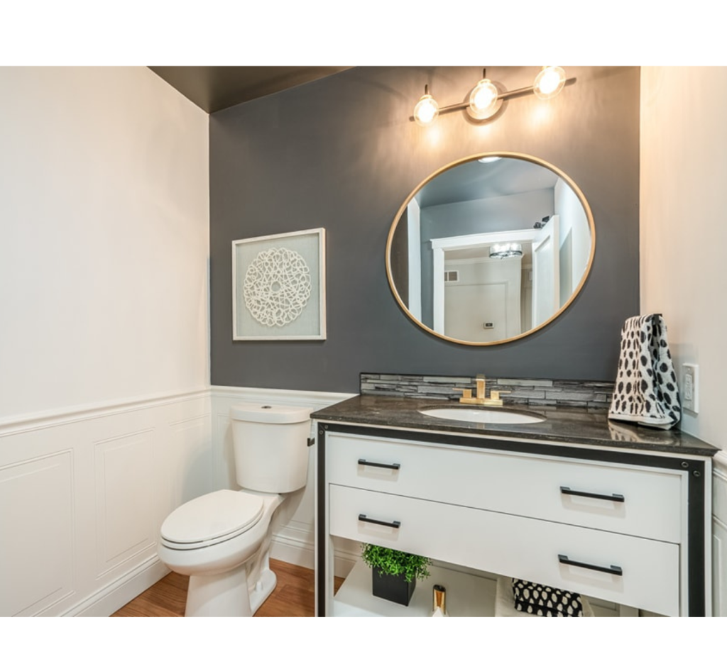 Chic Contrast & Golden Glow: A Stylish Powder Room